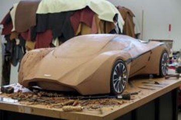 Early clay model being sculpted to explore vehicle proportions, volumes, and overall gesture at the start of the design process
