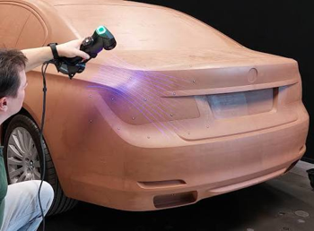 High-resolution scanner capturing the surface of a clay car model to create an accurate digital version for further refinement